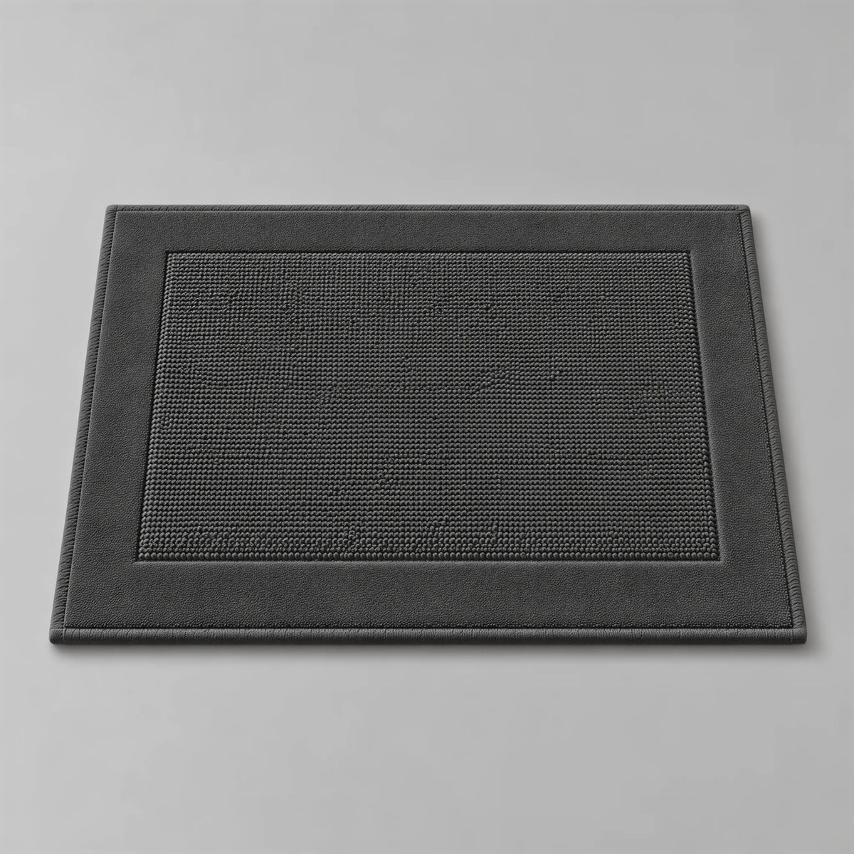 Badematte anthrazit dunkelgrau aus Zwirnfrottee, 50 x 70 cm, flach liegend auf hellgrauem Hintergrund