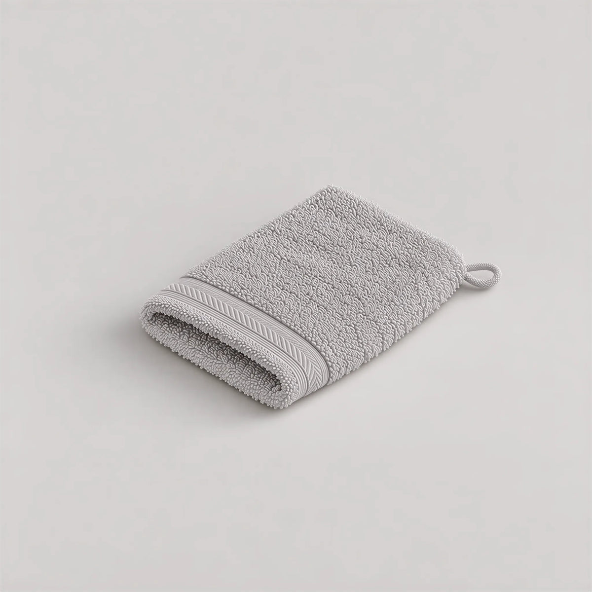 Waschhandschuh Grau aus Walkfrottee, 15 x 20 cm, gefaltet auf hellgrauem Hintergrund