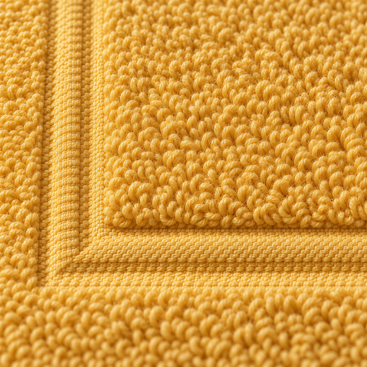 Nahaufnahme der weichen Frottee-Schlingen – Badvorleger Gold