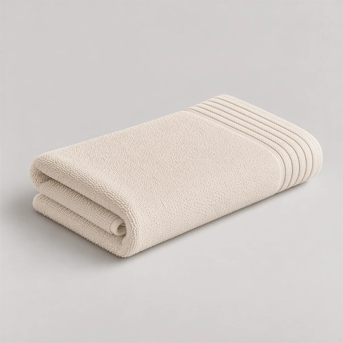 Handtuch creme beige aus Zwirnfrottee, 50 x 100 cm, gefaltet auf hellgrauem Hintergrund