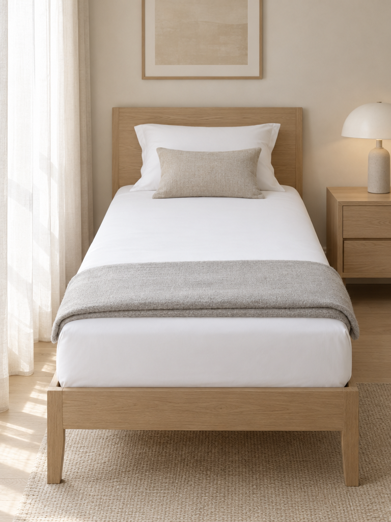 Inkontinenzauflage waschbar als Spannbettlaken auf einem Einzelbett