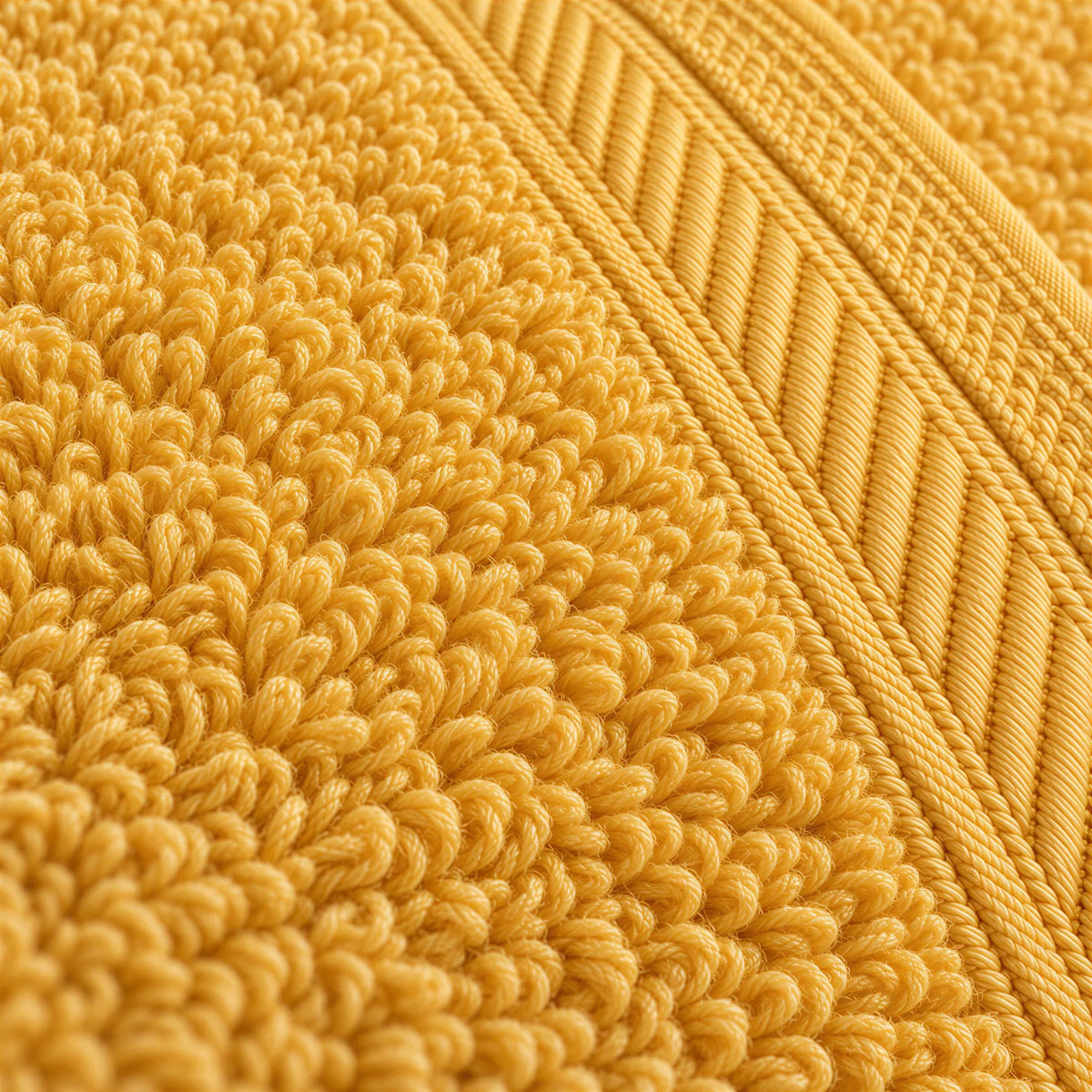 Nahaufnahme der weichen Frottee-Schlingen und der Bordüre – Waschhandschuh Gold
