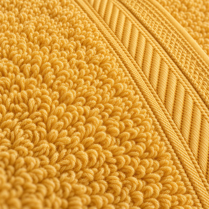 Nahaufnahme der weichen Frottee-Schlingen und der Bordüre – Waschhandschuh Gold